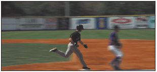 Panning the camera with this base runner stopped the action at a relatively low 1/125th second shutter speed